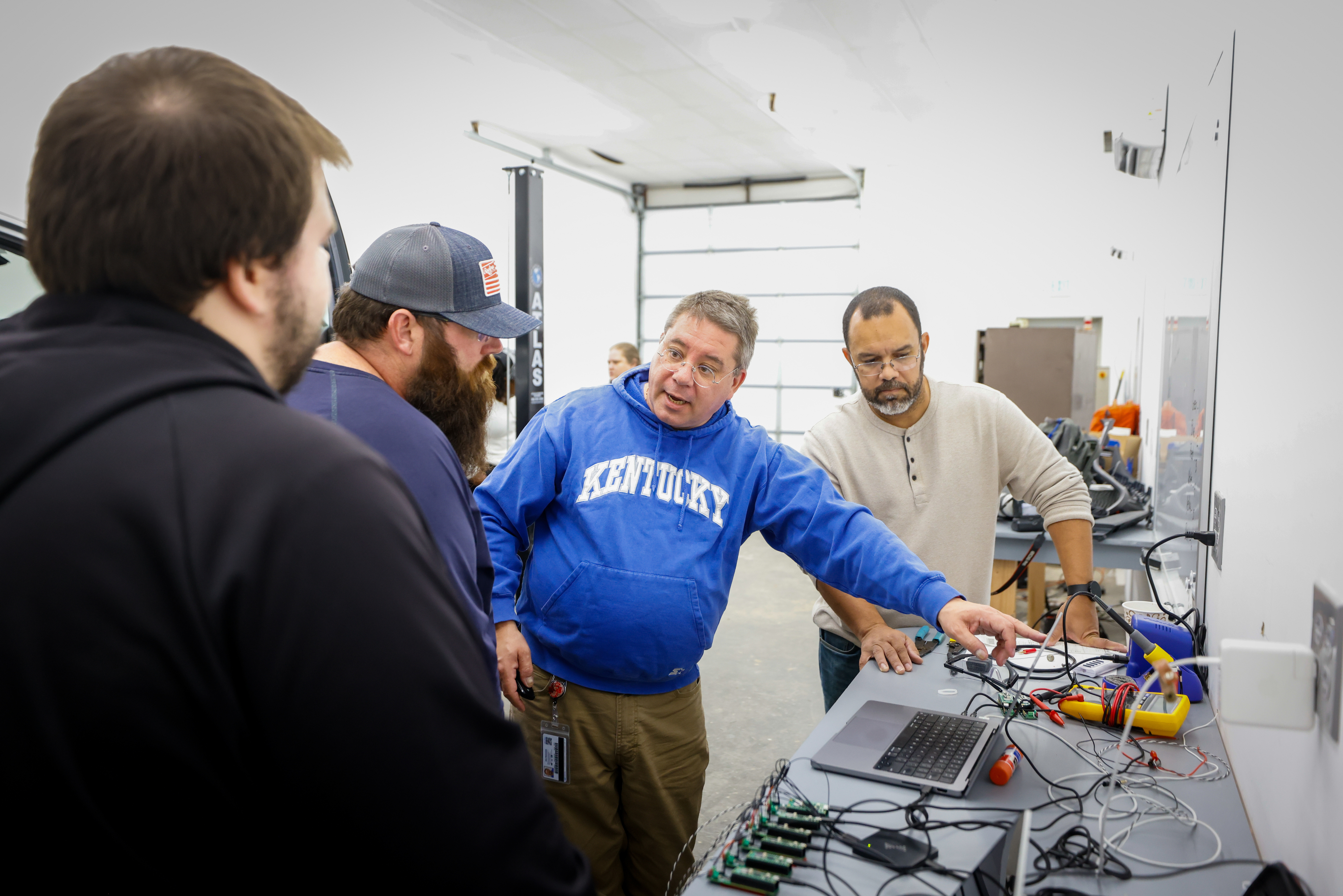 Instructor with students in Lab
